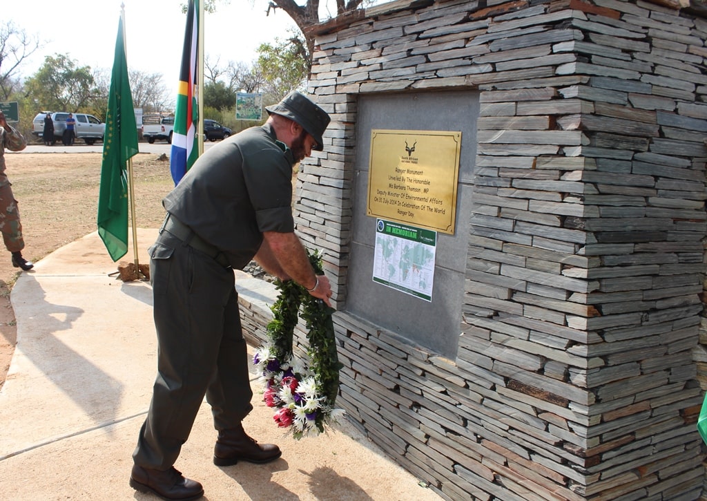Kruger ranger places a wreath at a memorial honoring slain rangers on World Ranger Day